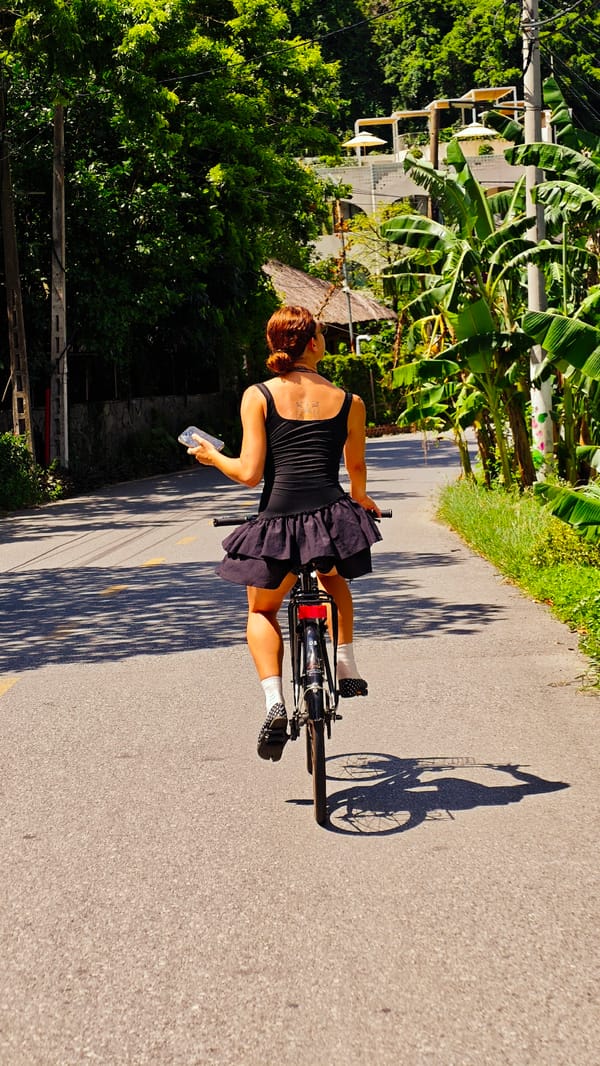 Cyclist spotted on curved mountain road in Vietnam
