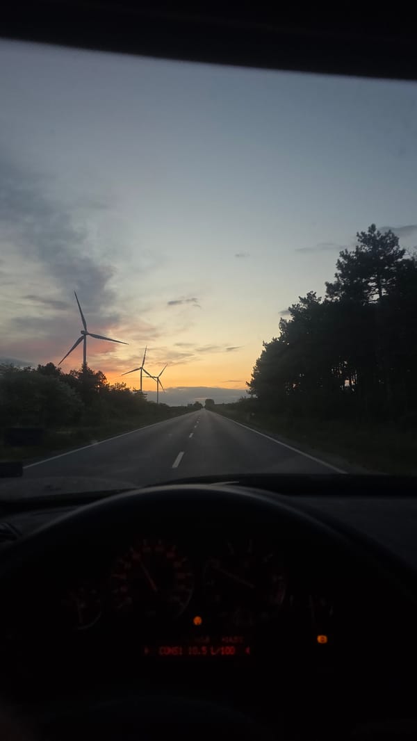 Vehicle travels wind turbine area near Balgarevo, Bulgaria