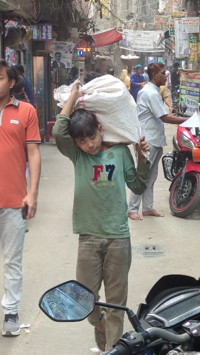 Morning street activity documented in busy Dhaka marketplace