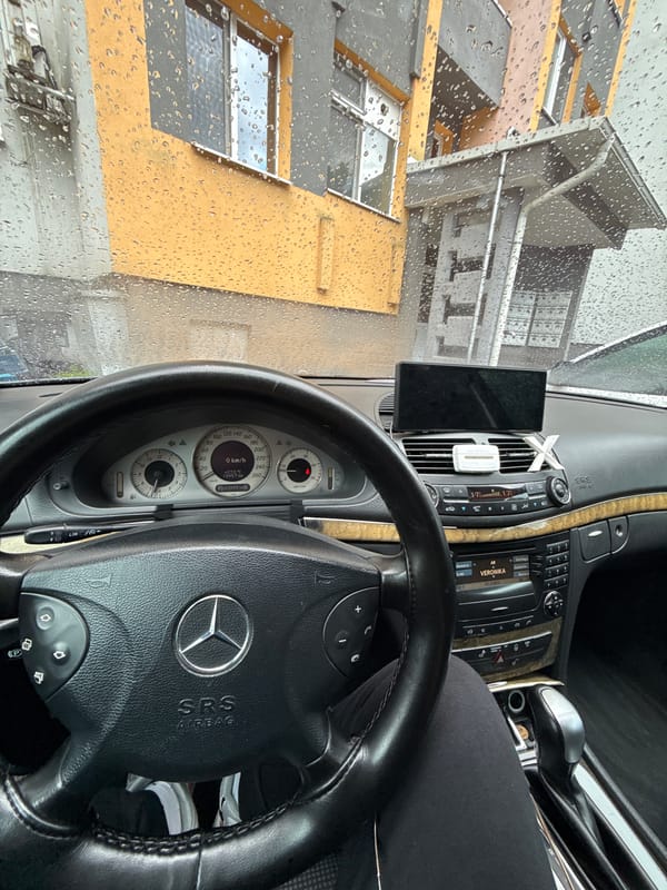 Man takes selfies in parked Mercedes during rain in Bulgaria