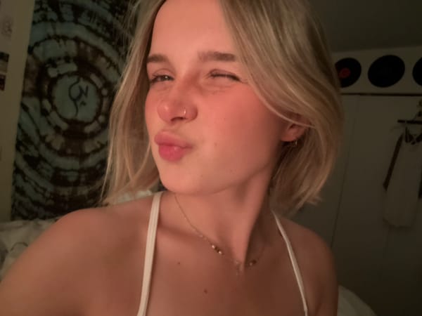 Woman takes morning selfies in Whistler room