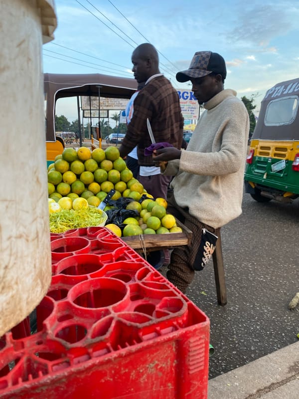 Bukuru street market buzzing with vendors and keke napeps at dusk