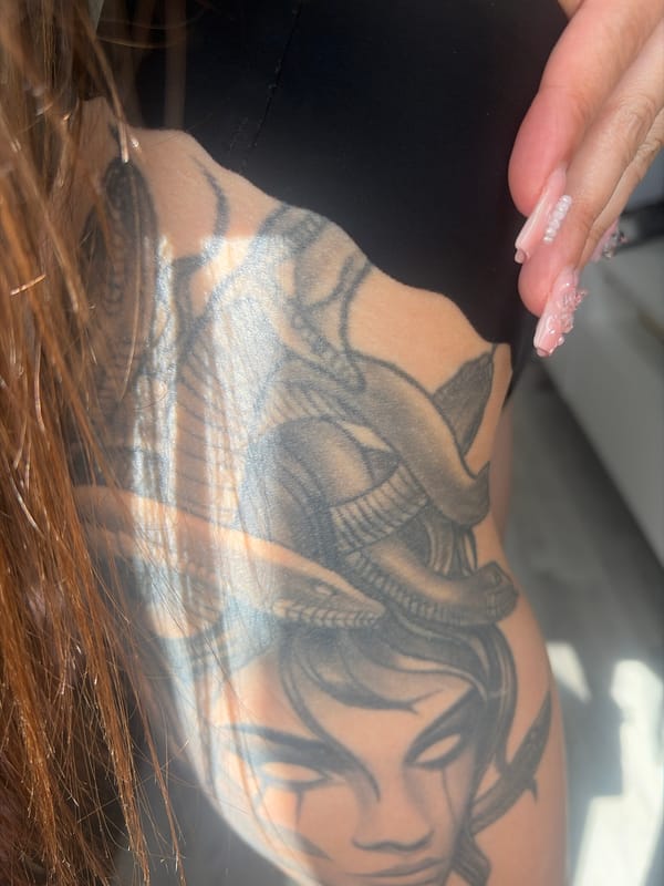 Tattoos, skin, and sunlight in a Saint Petersburg close-up session