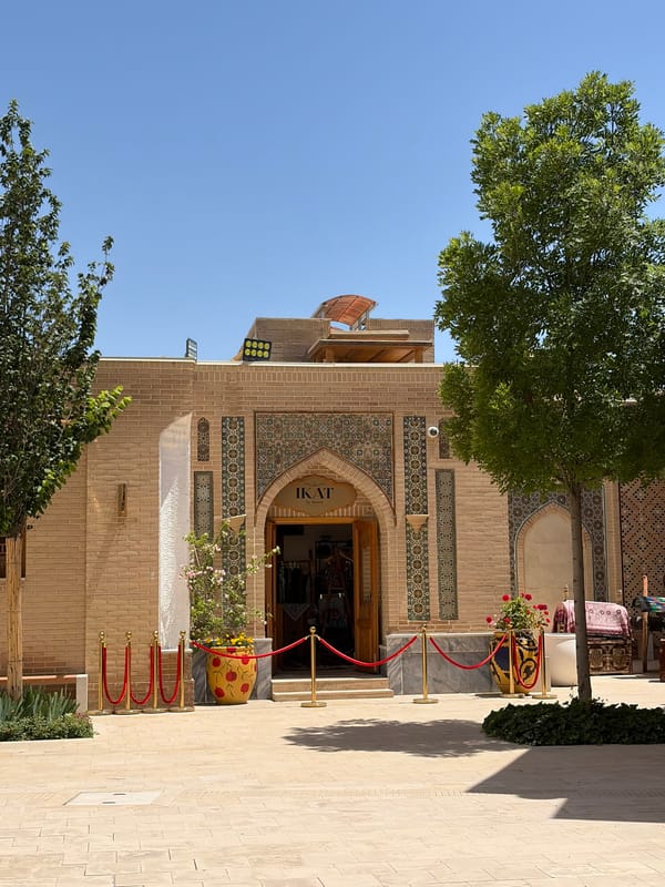 Tourist explores traditional architecture and markets in Kuchtumgali, Uzbekistan