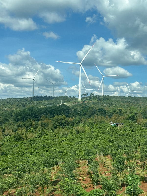 Wind farm overlooks coffee plantation in Tri C3, Vietnam