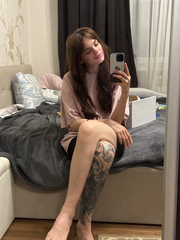 Woman takes selfies in bedroom in Rostov-on-Don