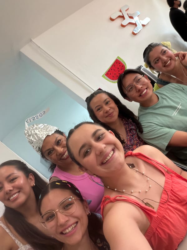 Young women gather for group photo with novelty decoration