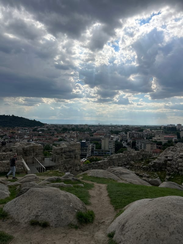 Ancient amphitheater, fountains, and city views on a sunny afternoon