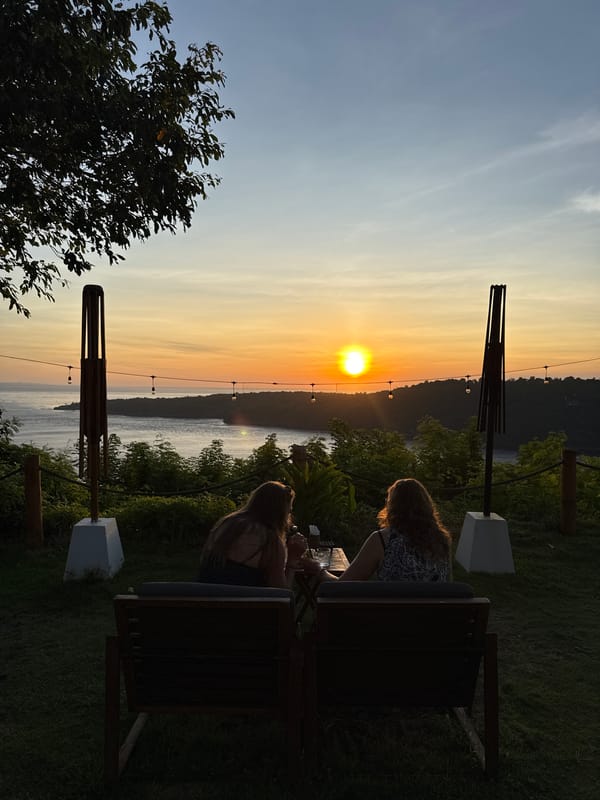Tourists gather at Nusa Penida overlook for sunset viewing