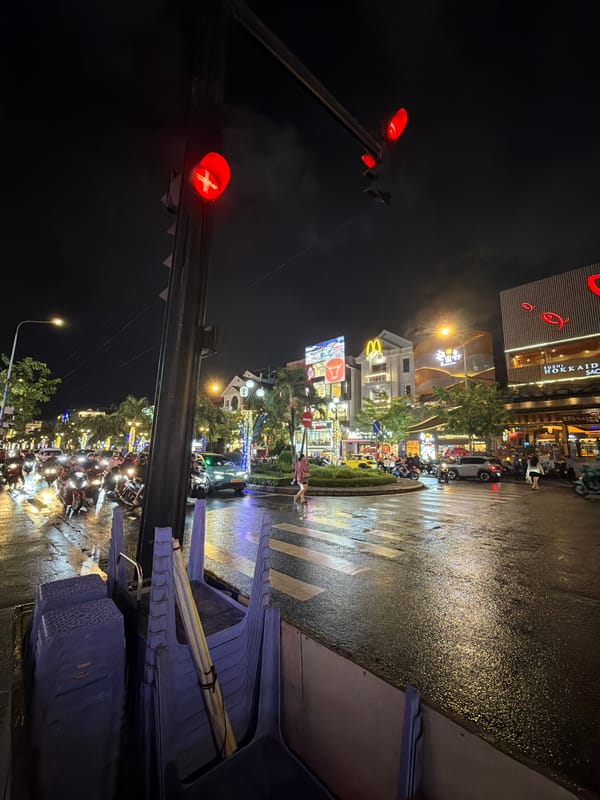 Rainy night street life documented in Thủ Đức City
