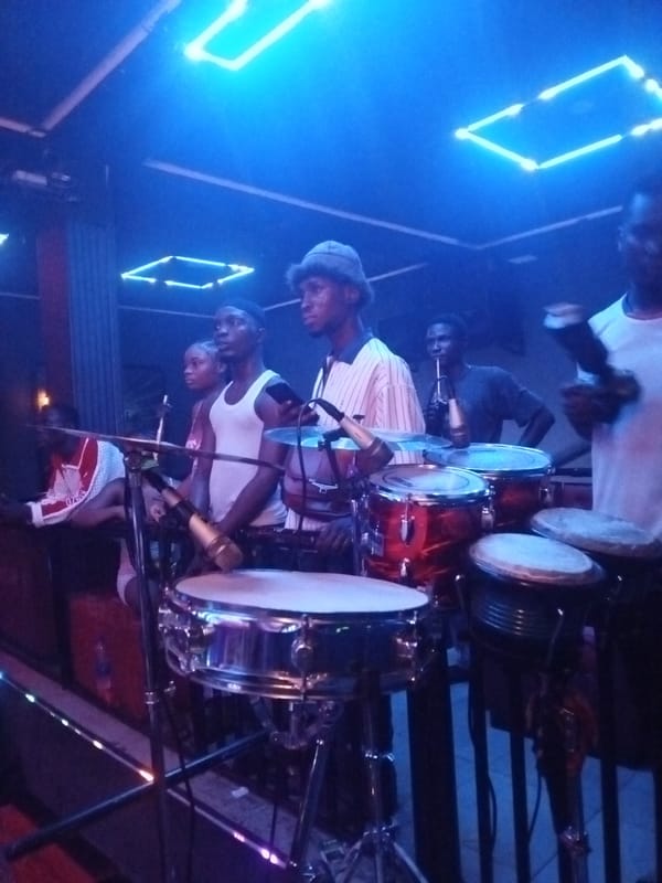 Live music performance at nightclub features Rolling Stones branding