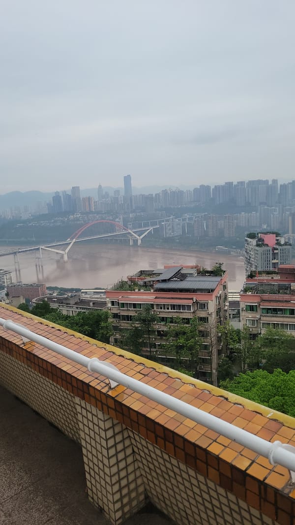 Aerial views document riverfront city during nine-minute observation period