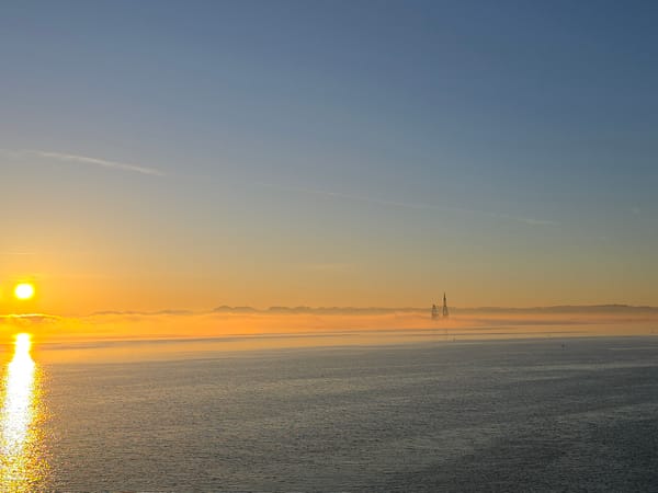 Dawn breaks over foggy Norwegian coastline near Randaberg