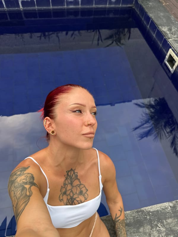 Woman takes selfies at decorated pool in Buduk
