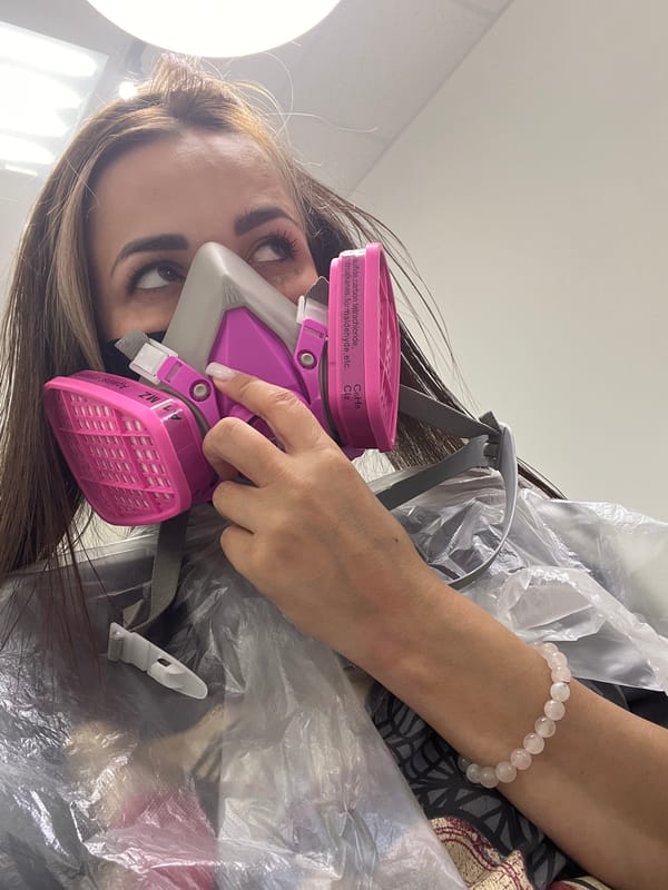 Salon visit selfies with a respirator mask and leopard-print shorts