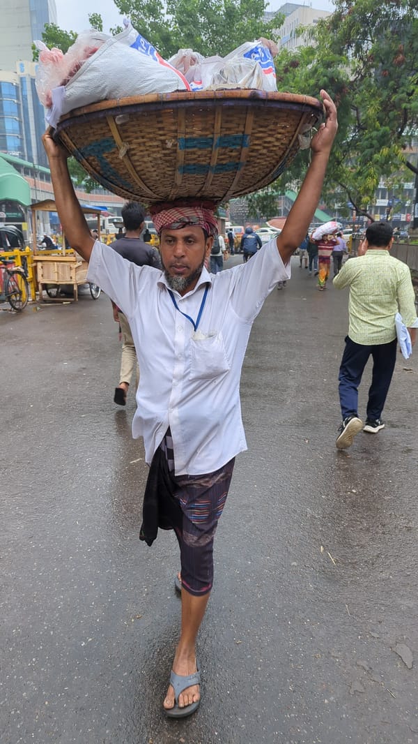 Early morning street food vendors operate in Dhaka
