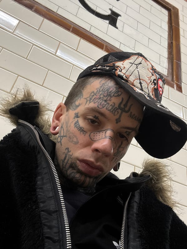 Close-up selfie with facial tattoos and fur-lined jacket, Buenos Aires