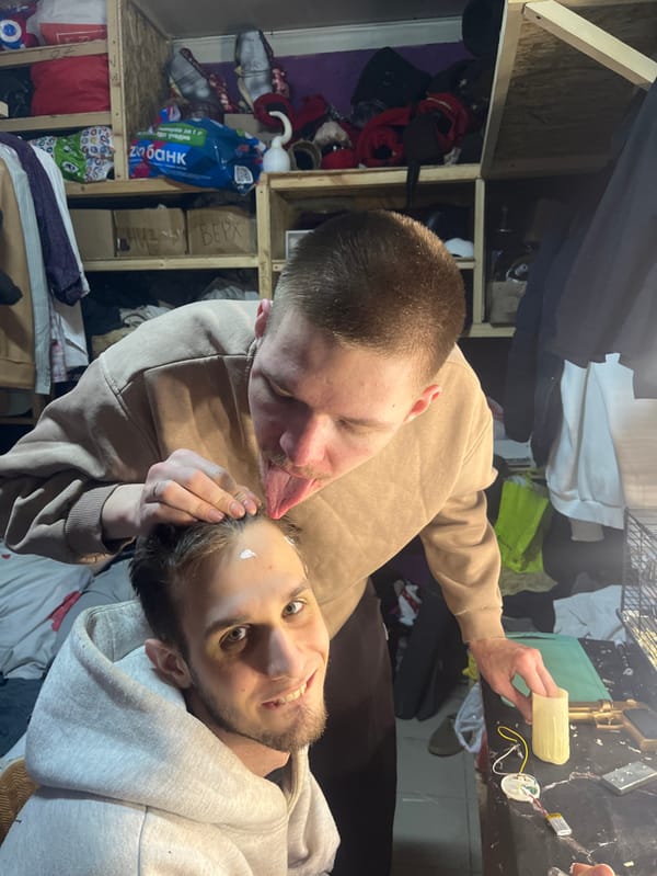 Two men stage casual photo session in Saratov apartment