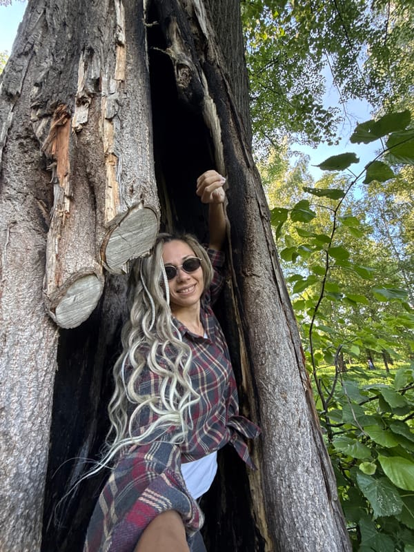 Woman photographed resting inside hollow tree trunk