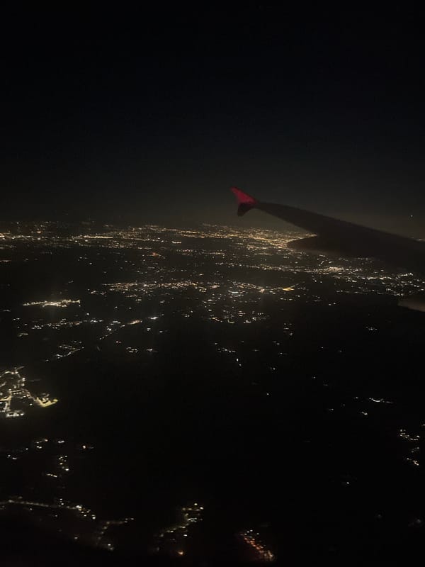 Aerial nighttime view captures lights along Trevignano Romano coastline