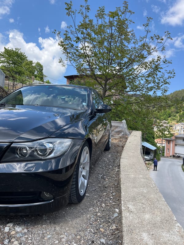 BMW sedan parked on gravel road in Chepintsi, Bulgaria