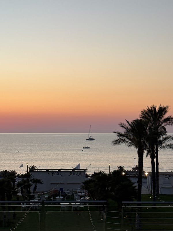 Sunset watch from a Sicilian coastal resort, July evening