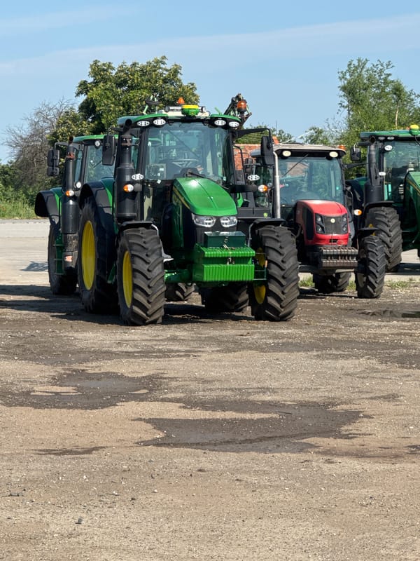 Farm equipment parked in rural Bulgarian village