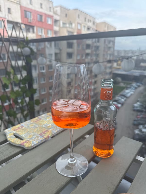 Orange beverage served in wine glass captured in Sofia