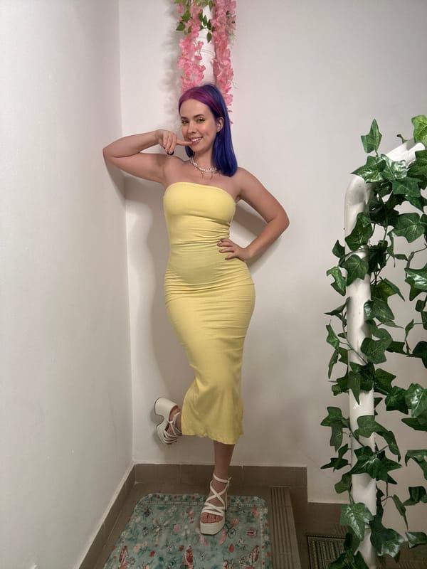 Woman in yellow dress poses for photos in Zagreb