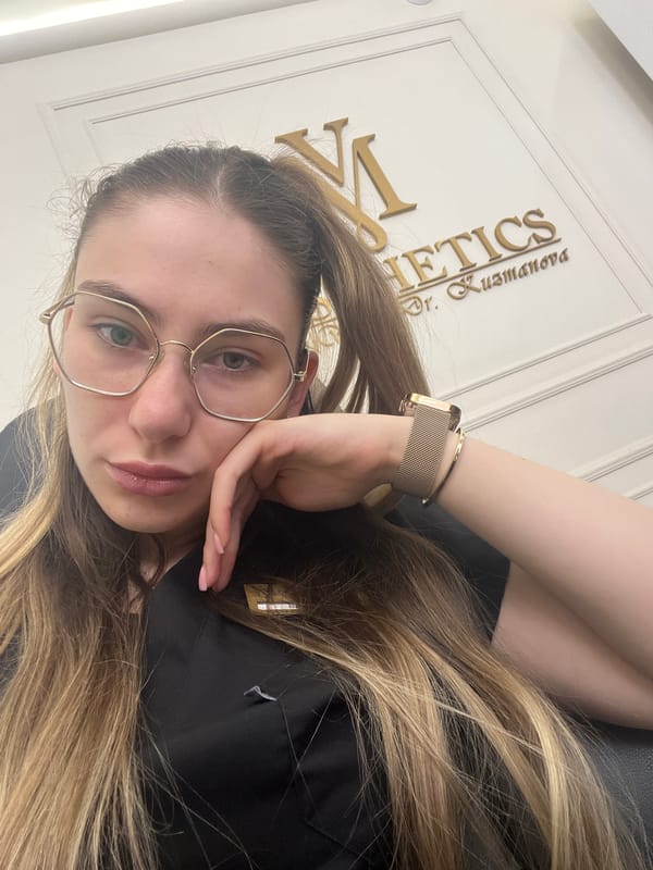 Selfie series featuring hexagonal glasses and a black embroidered top