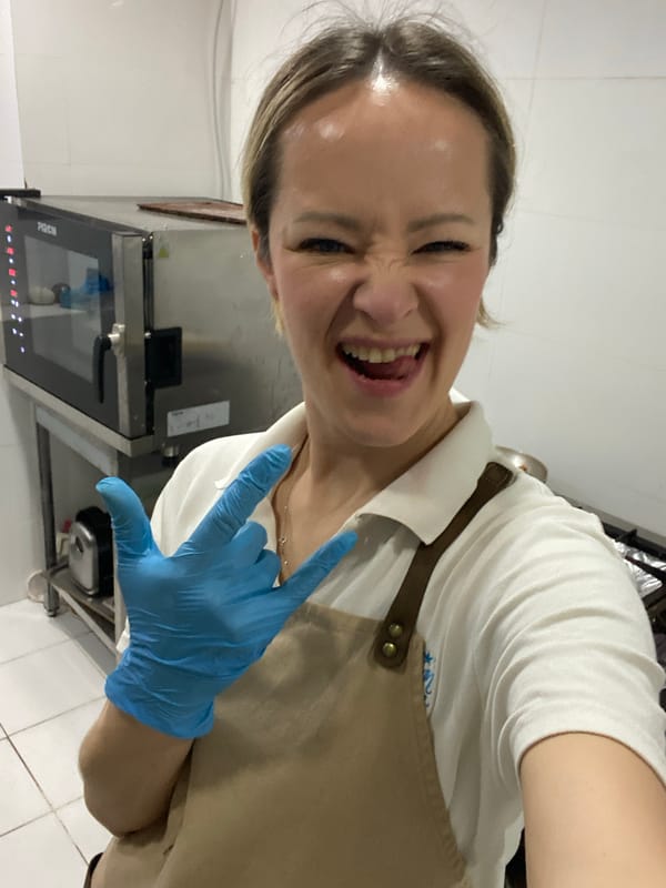 Woman captures joyful kitchen selfie in Montenegro