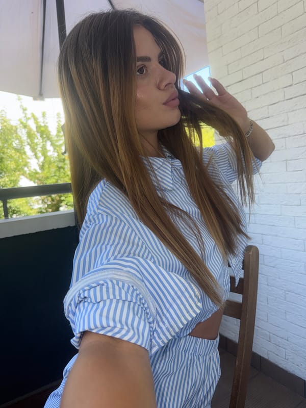 Selfie session in blue stripes across a Plovdiv balcony and indoors