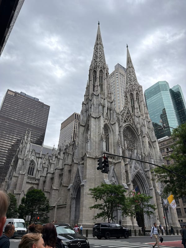 Midtown Manhattan afternoon: Pride flags, landmarks, and retail stops