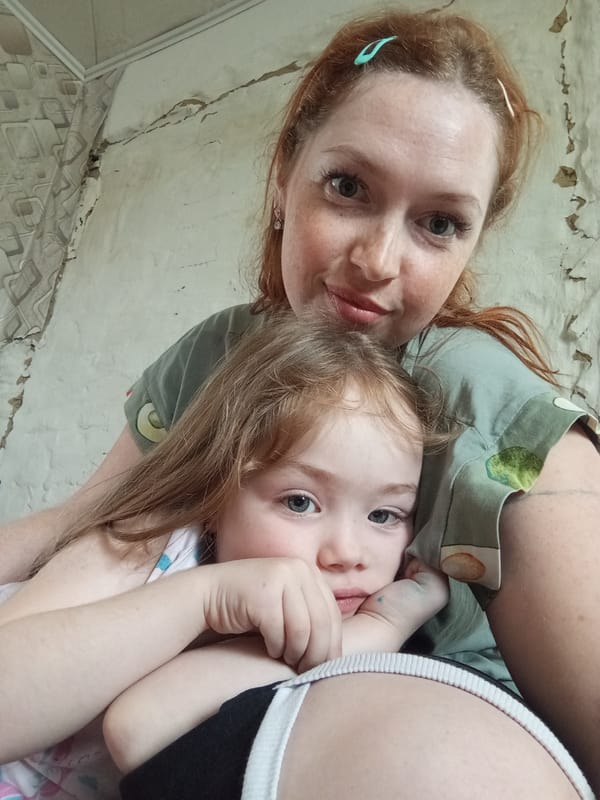 Mother and child share quiet morning moments in Yurgamysh home