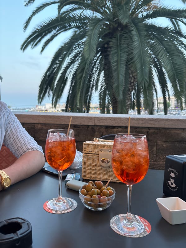 Evening stroll through Bari's cafes, decorated streets, food shops