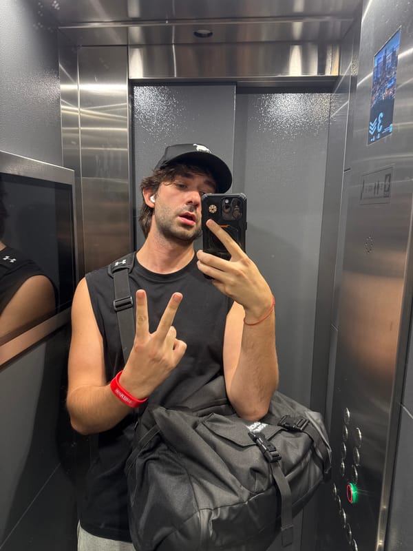 Elevator selfie moment in Moscow, casual and candid.
