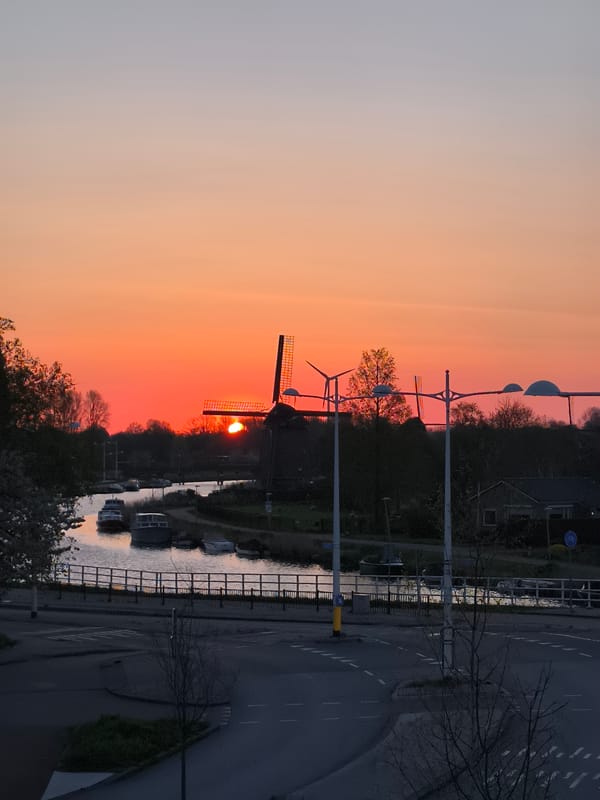 Vibrant sunset documented over Alkmaar canal in Netherlands