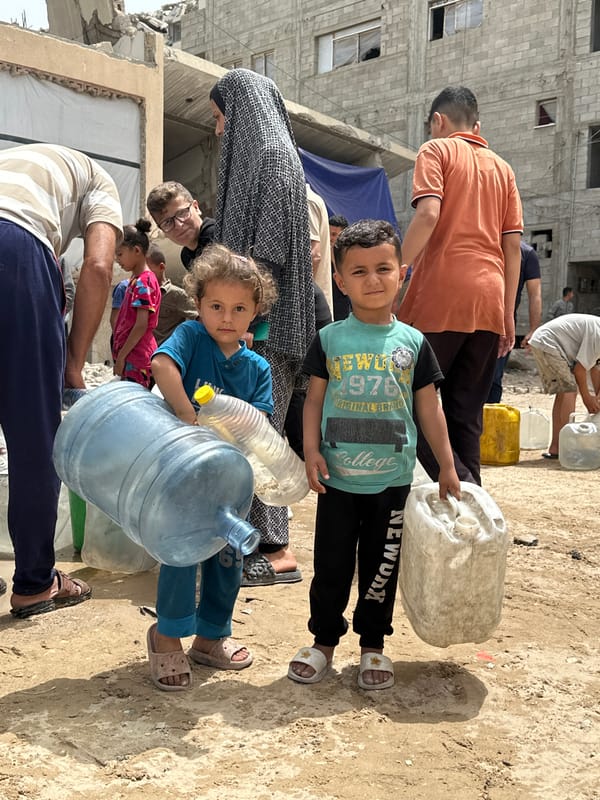 Children carry water, play amid debris in Gaza