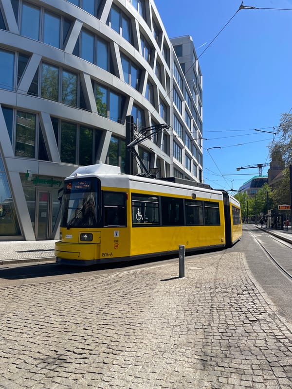 Ordinary Berlin morning: trams, river boats, street music captured