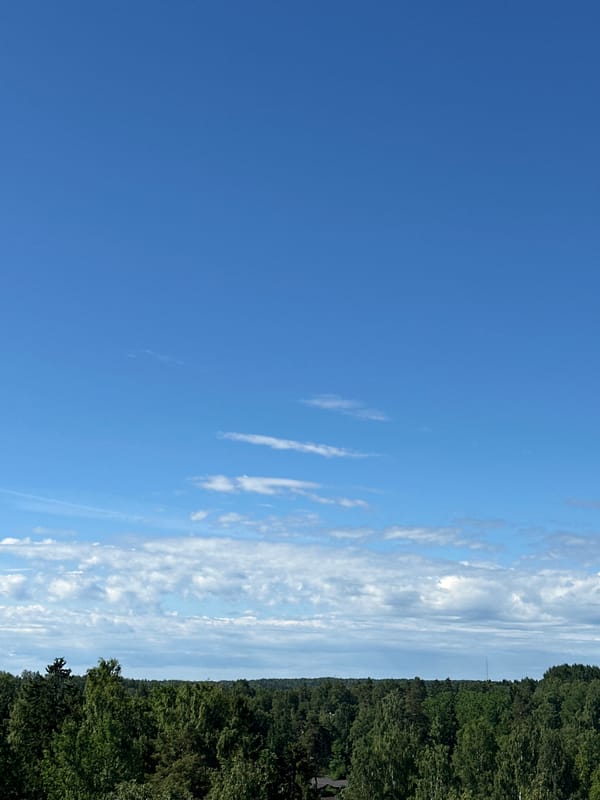 Planes on final approach over Helsinki's forested suburbs