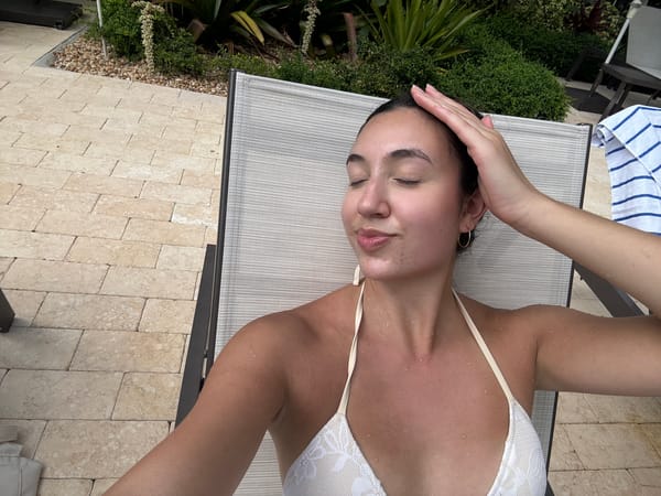 Woman enjoys leisurely afternoon poolside in Boca Raton