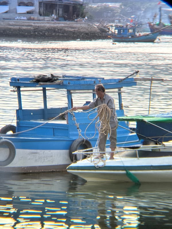 Lazy morning on Nha Trang's waterfront: boats, beach, and small finds