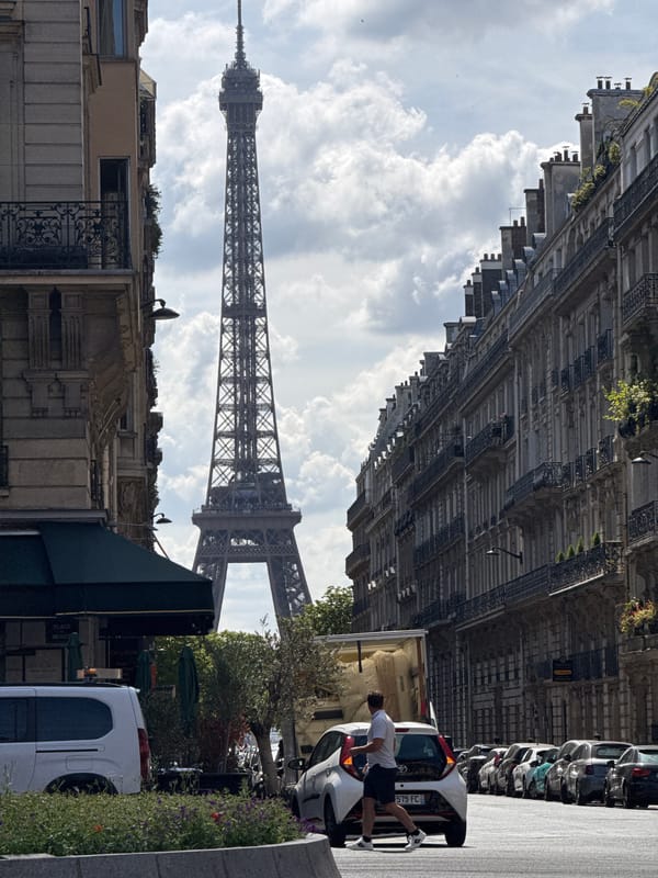 Crossing a Paris street with the Eiffel Tower in view