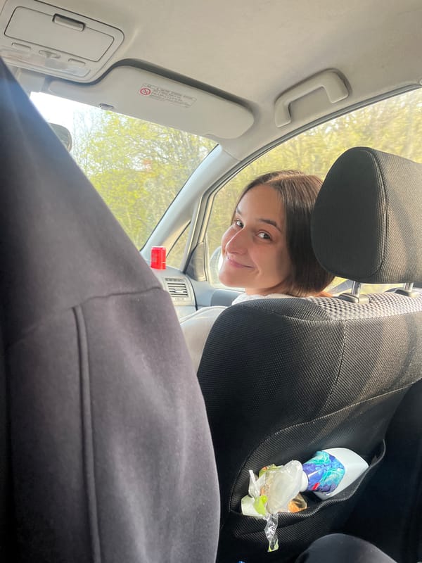 Woman photographed smiling inside car in Topolovo, Bulgaria