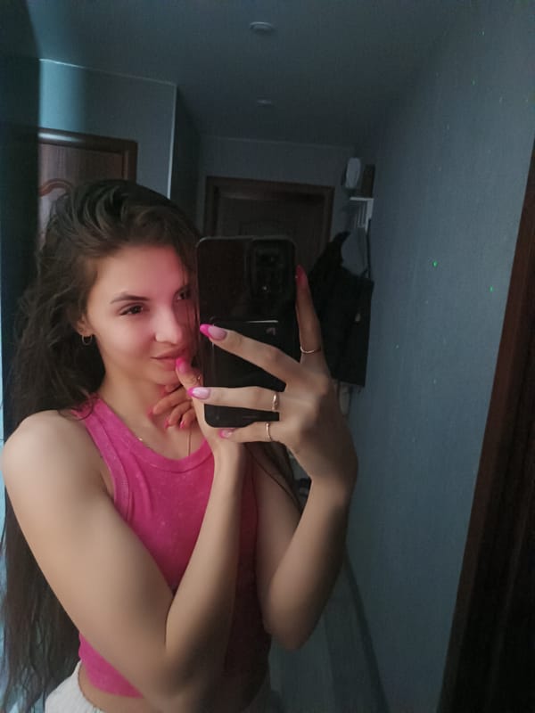 Woman takes selfies at home with starry ceiling projector