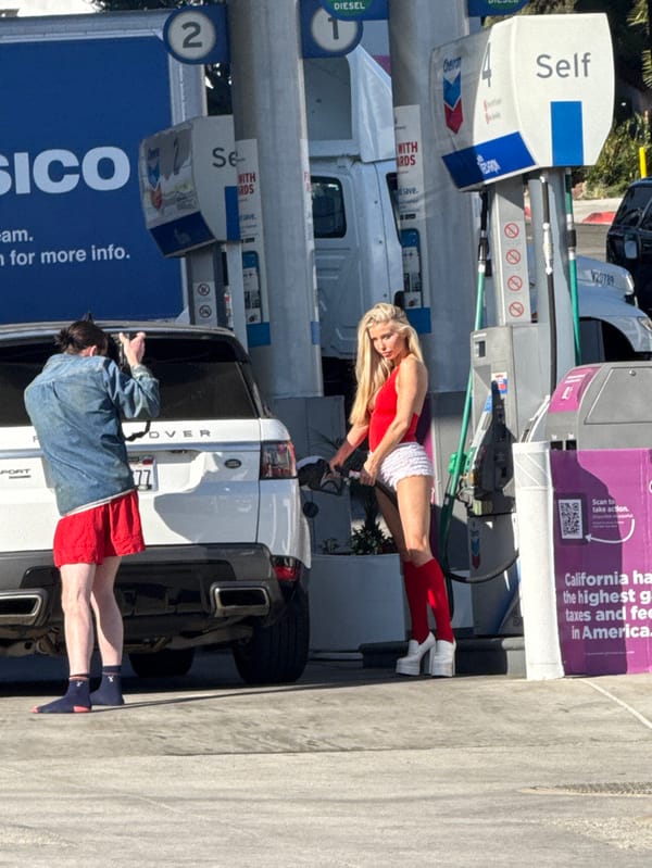 Woman spotted at West Hollywood Chevron with Range Rover