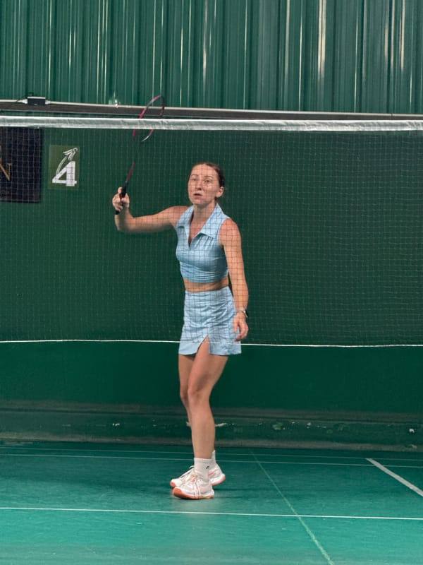 Indoor badminton matches and social activities in Thailand sports facility