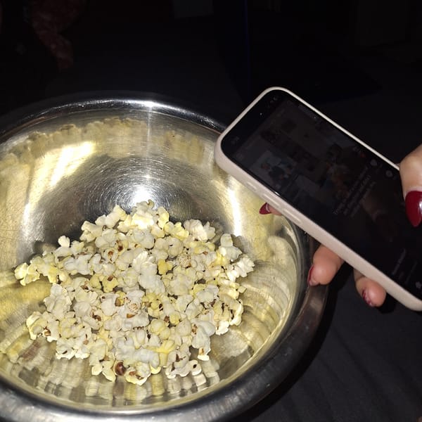 Person films popcorn bowl for social media in Vidin