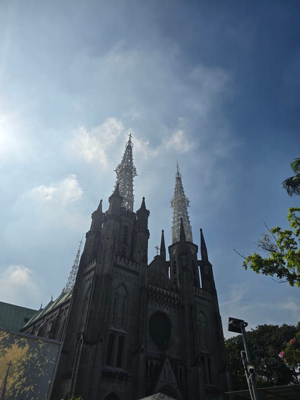 Morning sightings of Jakarta Cathedral and Dirgantara Monument captured