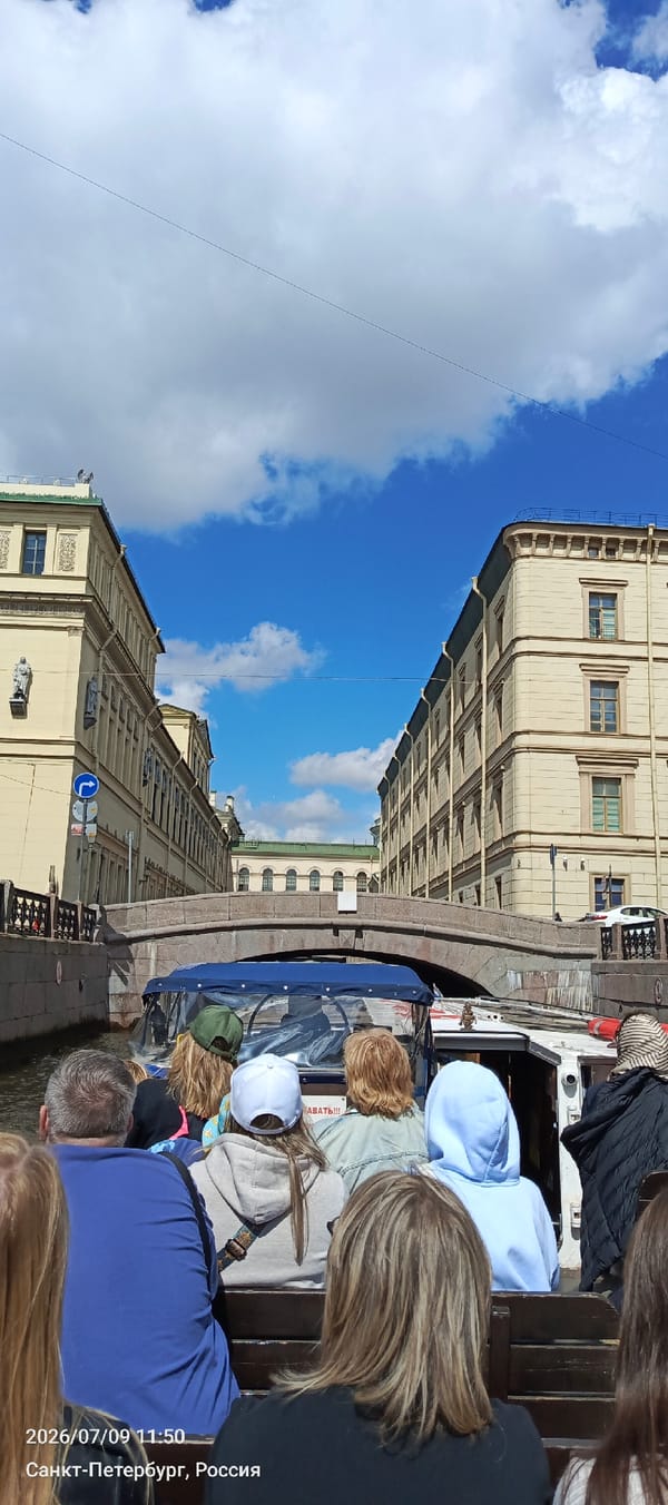 Canal boats and the Hermitage on a summer day in St. Petersburg